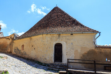 Fototapeta na wymiar Historical buildings on the territory of the Rasnov Citadel. Transylvania. Romania
