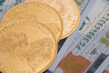 Austrian four ducats on US dollars. Investments in investment coins. The concept of buying gold. investment in gold.