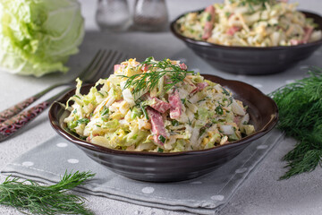 Salad with Chinese cabbage, eggs, cheese and sausage, dressed with mayonnaise, Close up