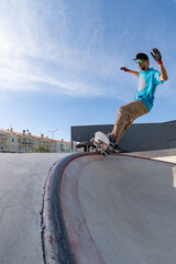 Skateboarder doing frontside five-o grind trick