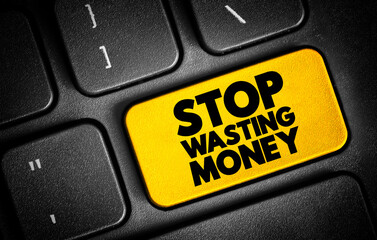 Fototapeta premium Stop Wasting Money text button on keyboard, concept background