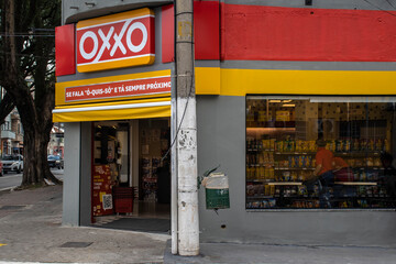 Sao Paulo, Brazil, April 29, 2023. Front view of Oxxo supermarket in Sao Paulo city. Oxxo is popular Mexican chain of grocery stores or convenience stores