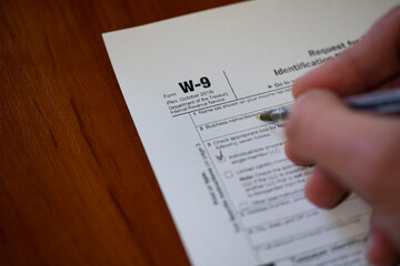 Obraz premium Tax Form W-9 Request for Taxpayer Identification Number and Certification, business concept.