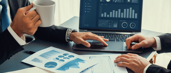 Closeup busy analyst team with coffee discuss financial data on digital dashboard, analyzing chart...