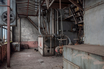 Fototapeta na wymiar Exploring the Enigmatic Beauty of an Abandoned, Historic Boiler Room: Unveiling the Secrets of a Forgotten Architectural Gem
