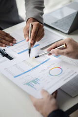 Two businessmen pointed to the material for the meeting, working together to plan to develop and solve common business problems. Concept of business management for growth and quality.