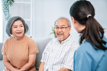 Female doctor visiting a contented elderly couple at their home. Health care, senior health support...
