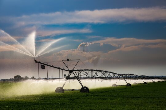 Pivit, circle irrigation in an agriculture field along highway 138 near Orvid, Nebraska.  storm clouds are forming in background.