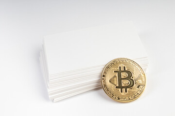 Mockup of business cards fan stack, bitcoin at white textured paper background.