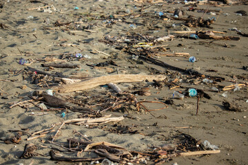 The pile of garbage on the beach is alarming, requiring action to maintain cleanliness and the beauty of nature.
