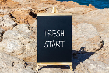 Fresh start and motivational symbol. Concept words Fresh start on beautiful black chalk blackboard...