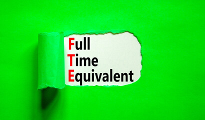 FTE Full time equivalent symbol. Concept words FTE Full time equivalent on beautiful white paper. Beautiful green table green background. Business and FTE Full time equivalent concept. Copy space.
