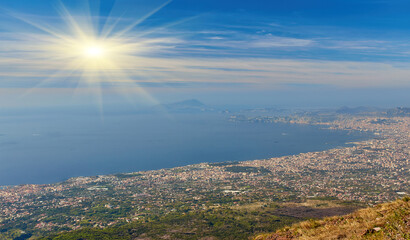 Panoramic view from volcano Mount Vesuvius on the bay of Naples, Province of Naples, Campania region, Italy, Europe. Looking at the island of Capri and Mediterranean coastline on a cloudy day.