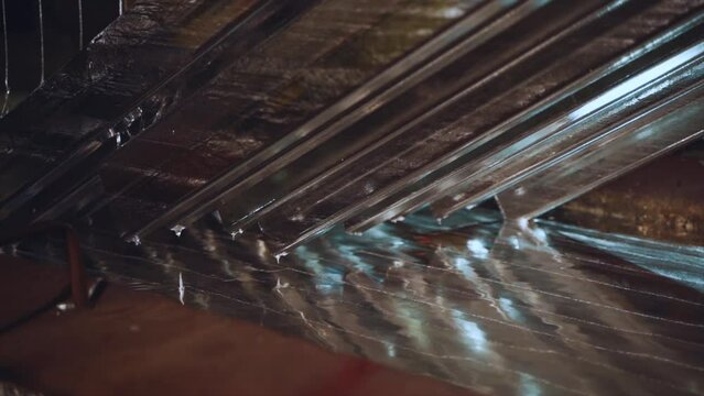The process of galvanizing metal, the working processes of the hot-dip galvanizing plant, metal production, shooting in slow motion