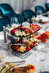 Beautifully laid out dishes on the table, sausage, meat, salt, bread