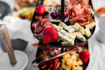 Beautifully laid out dishes on the table, sausage, meat, salt, bread