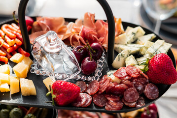 Beautifully laid out dishes on the table, sausage, meat, salt, bread