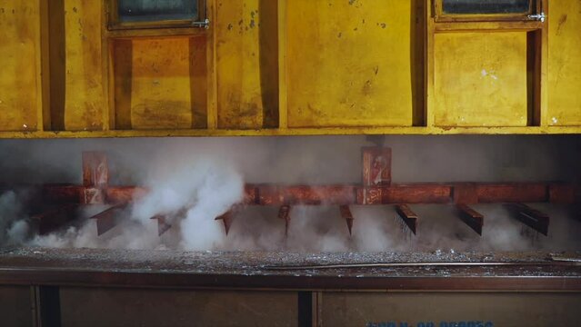 The process of galvanizing metal, the working processes of the hot-dip galvanizing plant, metal production, shooting in slow motion