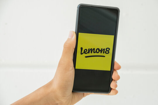 Benidorm, Spain - April 06, 2023: Hand holds cell phone with Lemon8 app. Lemon8 is video and photo-sharing social media platform catering to users interest in food, beauty, wellness and travel