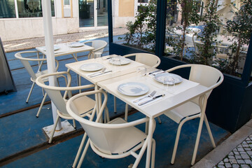 Empty cafe tables on the veranda of the restaurant