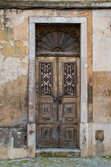 Fototapeta na wymiar Facade of an old house with vintage door, European historical buildings, Lisbon, Portugal