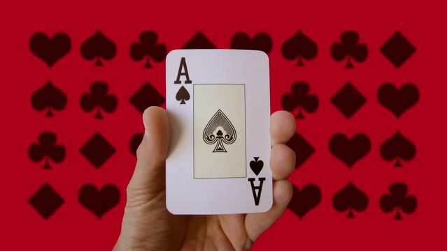 hand holding playing cards