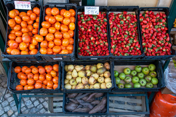 Organic fruit on display, stand with vegetables and fruits in front of the store, Lisbon, Portugal