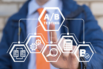 Man using virtual touchscreen presses inscription: A/B TESTING. AB testing wireframe campaign for...