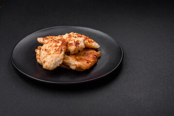 Delicious fried chicken meat chops with spices, salt and herbs