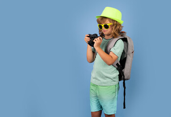 Kid on travel, isolated studio portrait. Child travel and adventure concept.