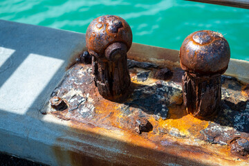 Rusty moorings on the dock
