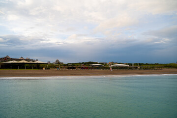 Sun loungers on the beach at sunrise.