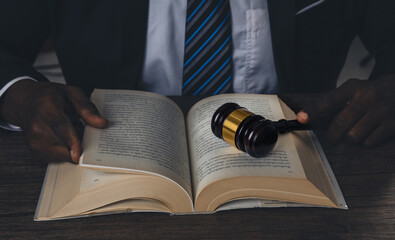 Lawyer showing judge gavel . Business Man hold judge gavel , lawyer or attorney concept. lawyer holding judge gavel in courtroom,  Court of Law and Justice Trial Session