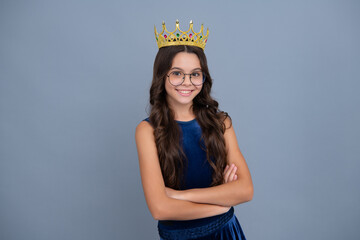Teenager princess child celebrates success win and victory. Teen girl in queen crown. Happy girl...