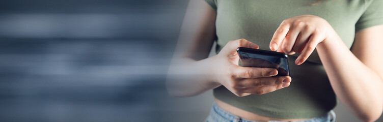 hand of woman using smartphone