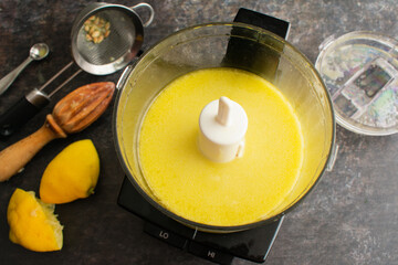 Homemade Salad Dressing in a Mini-Prep Bowl: Blended extra virgin olive oil, lemon juice, and salt in a food processor