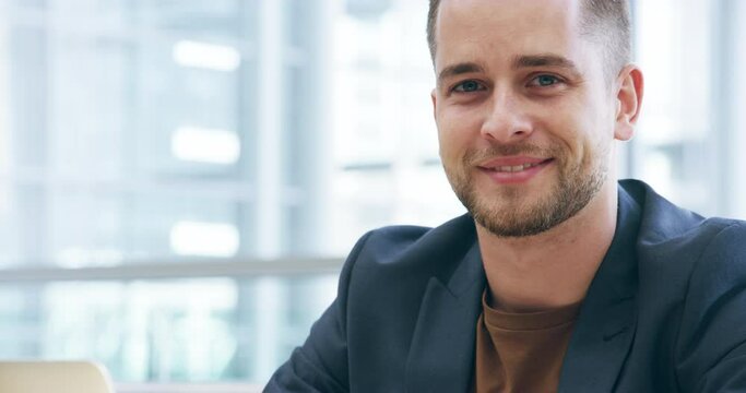 Laptop, happy and an auditor man typing a report for feedback on a company while working in the office. Portrait, smile and computer with a young male business employee at work in an auditing firm