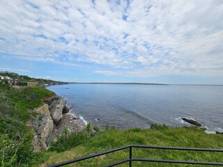 .The Cliffwalk in Newport, Rhode Island offers a breathtaking coastal trail with stunning ocean views and historic mansions.