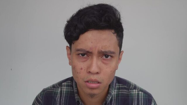 Young man Indonesian disagree with a statement. The footage is suitable to use for advertising and expression content media.
