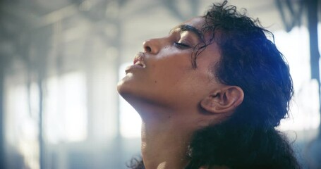 Tired, sweating or breathing with face of girl in gym for cardio workout or wellness relaxing. Exercise training, breathe or portrait of exhausted female sports athlete resting in fitness center