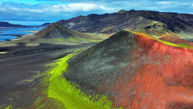 Extinct volcanoes, Volcanic mountain covered with moss in early spring. Pure untouched nature in Iceland, Traces of geothermal activity on earth, Epic aerial view 4k