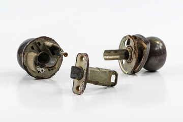 Broken old door knob with white background.