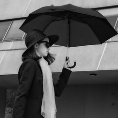 Black suit and black umbrella