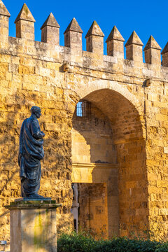 Statue of Seneca with the Almodovar Gate and Walls of Cordoba built in the Caliphate Period, Cordoba, Andalusia, Spain