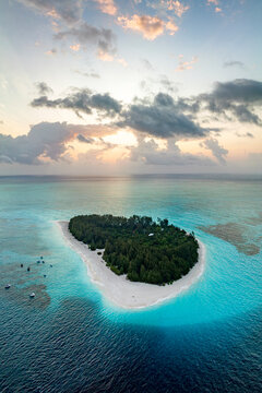 Aerial panoramic view of idyllic tropical atoll at dawn, Mnemba Island, Zanzibar, Tanzania