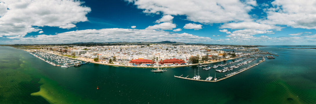Aerial panoramic drone view of Olhao, officially known as Olhao da Restauracao, a city and municipality in the Algarve region, southern Portugal