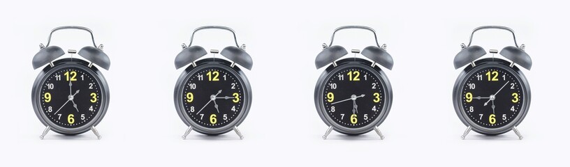 close up of a set of black alarm clocks showing the time; 5, 5.15, 5.30 and 5.45 p.m dan a.m. Isolated on white background
 - obrazy, fototapety, plakaty