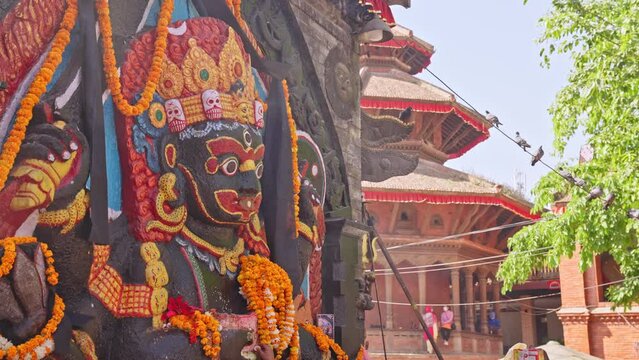 Slow motion parallax of the Kaal Bhairav statue in Durbar Square, Kathmandu, Nepal