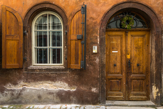 Facade of house with arched window and wooden door in historical center, UNESCO World Heritage Site, Cesky Krumlov