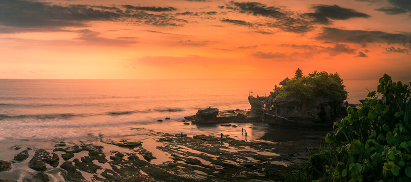 View of Tanah Lot, traditional Balinese temple at sunset, Beraban, Kediri, Tabanan Regency, Bali